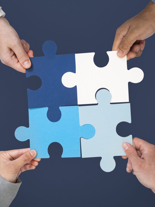 Hands holding puzzle business problem solving concept